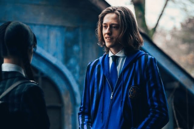 Netflix's Wednesday series's Xavier chatting with Wednesday Addams in the woods
